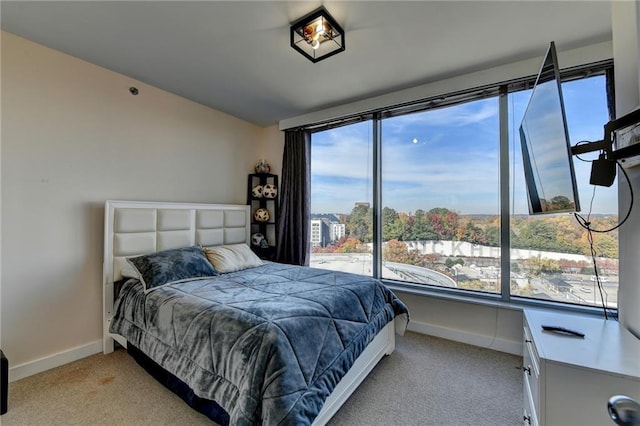 bedroom featuring light colored carpet