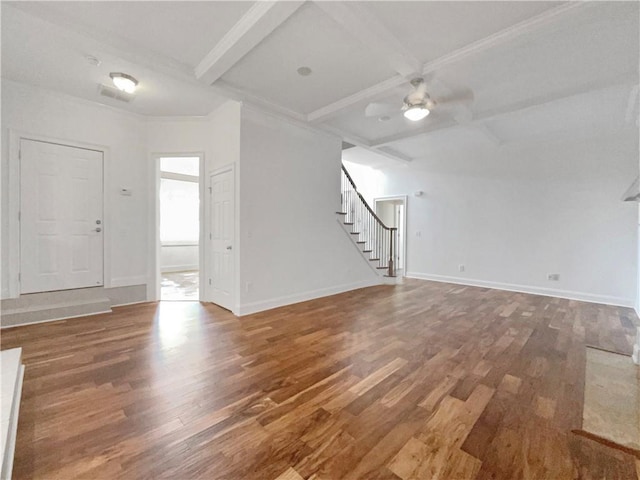 unfurnished living room with ceiling fan, dark hardwood / wood-style flooring, beam ceiling, and coffered ceiling