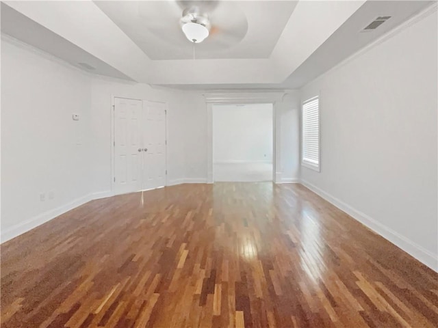 spare room featuring ceiling fan and hardwood / wood-style flooring