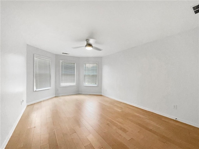 empty room featuring ceiling fan and light wood-type flooring