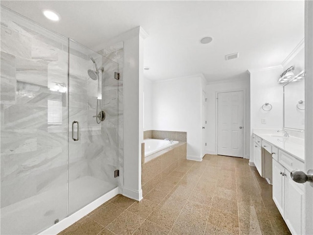 bathroom featuring vanity and shower with separate bathtub