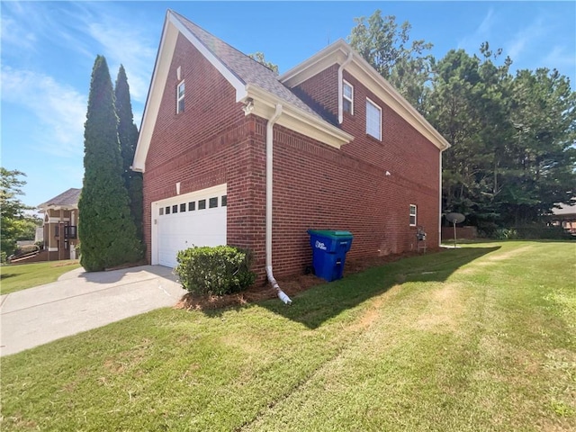 view of side of home featuring a garage and a lawn