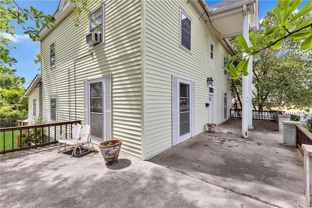 exterior space featuring cooling unit and a patio