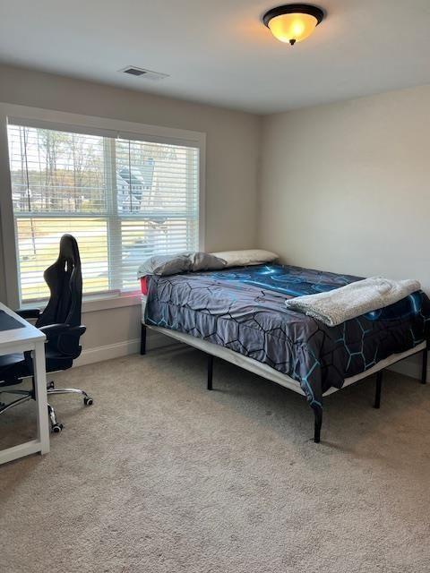 224 Crest Creek Way, Villa Rica, GA 30180 - carpeted bedroom featuring a desk and baseboards