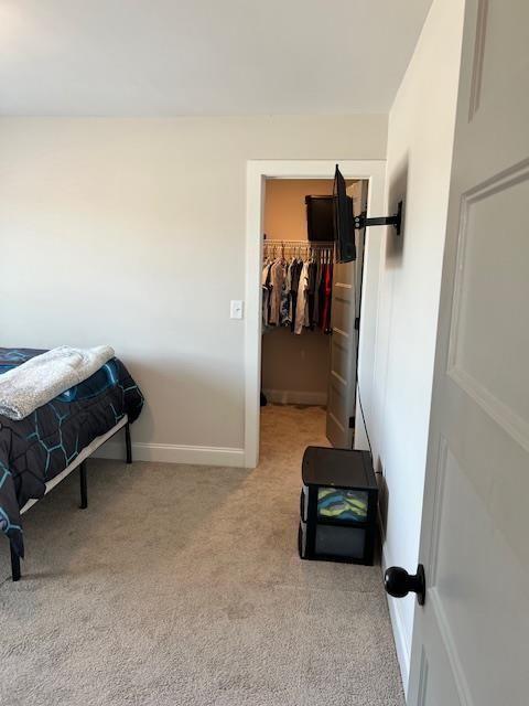 224 Crest Creek Way, Villa Rica, GA 30180 - carpeted bedroom with a walk in closet and a closet