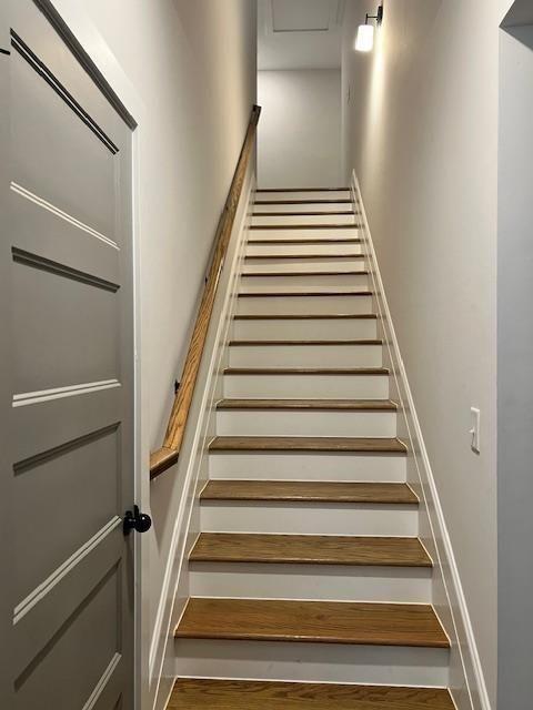 224 Crest Creek Way, Villa Rica, GA 30180 - staircase featuring wood finished floors and baseboards