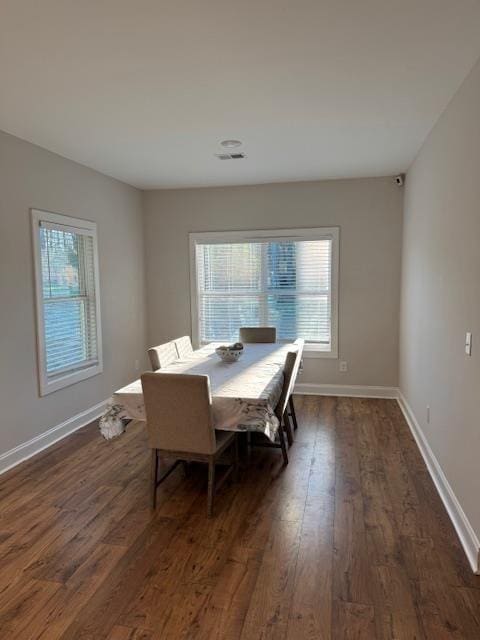 224 Crest Creek Way, Villa Rica, GA 30180 - dining area featuring dark wood-style floors and baseboards