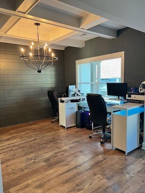 224 Crest Creek Way, Villa Rica, GA 30180 - office featuring a chandelier, coffered ceiling, wood finished floors, beam ceiling, and wooden walls