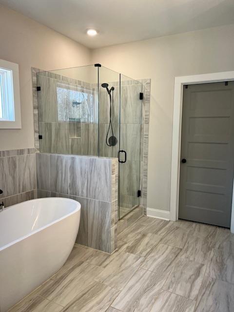 224 Crest Creek Way, Villa Rica, GA 30180 - full bathroom with a freestanding tub and a shower stall