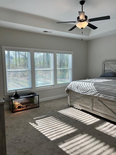 224 Crest Creek Way, Villa Rica, GA 30180 - carpeted bedroom with baseboards and a ceiling fan