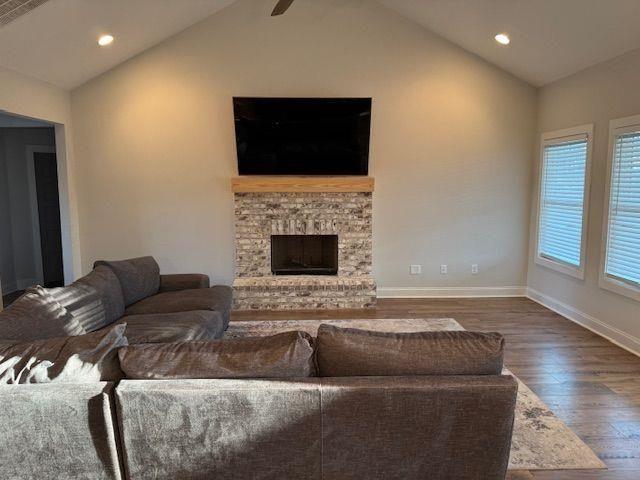 224 Crest Creek Way, Villa Rica, GA 30180 - living area with vaulted ceiling, wood finished floors, recessed lighting, and a fireplace