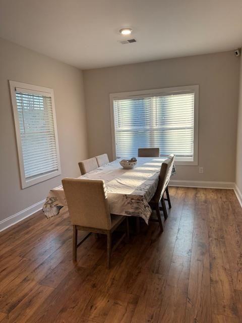 224 Crest Creek Way, Villa Rica, GA 30180 - dining area with dark wood-style floors and plenty of natural light