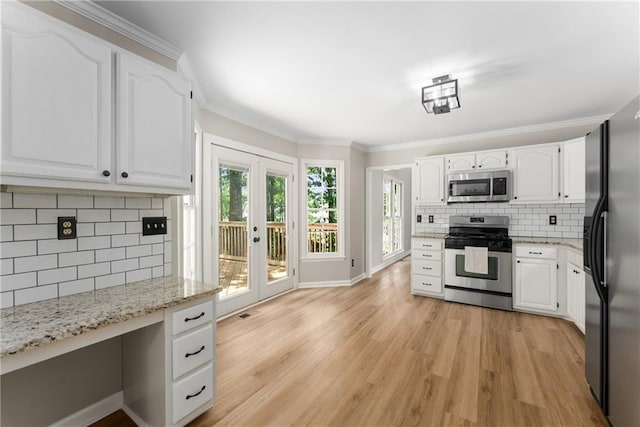 4816 Morning Chase NW, Acworth, GA 30102 - kitchen with stainless steel appliances, light stone counters, decorative backsplash, light wood finished floors, and white cabinets