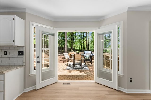 4816 Morning Chase NW, Acworth, GA 30102 - entryway featuring plenty of natural light, light wood-style flooring, ornamental molding, and french doors