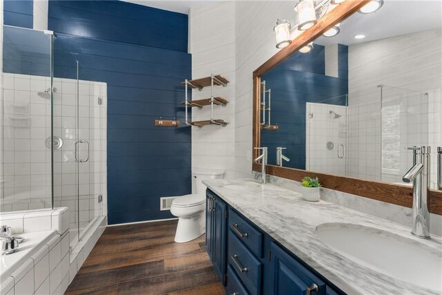 4816 Morning Chase NW, Acworth, GA 30102 - bathroom featuring double vanity, wood finished floors, a shower stall, and a bath