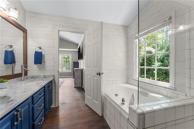 4816 Morning Chase NW, Acworth, GA 30102 - full bathroom with vaulted ceiling, wood-type flooring, double vanity, and a jetted tub