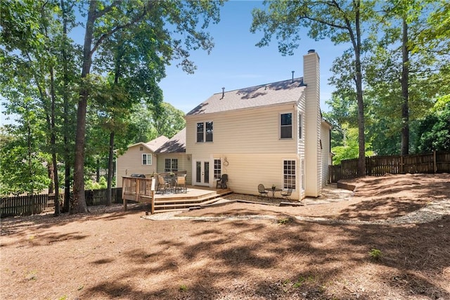 4816 Morning Chase NW, Acworth, GA 30102 - back of house with french doors, a chimney, a fenced backyard, and a deck