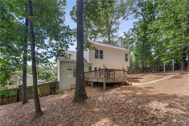 4816 Morning Chase NW, Acworth, GA 30102 - back of property featuring a fenced backyard, a wooden deck, and a chimney