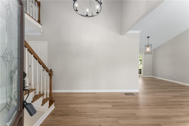 4816 Morning Chase NW, Acworth, GA 30102 - entryway featuring a chandelier, light wood finished floors, stairs, and a high ceiling