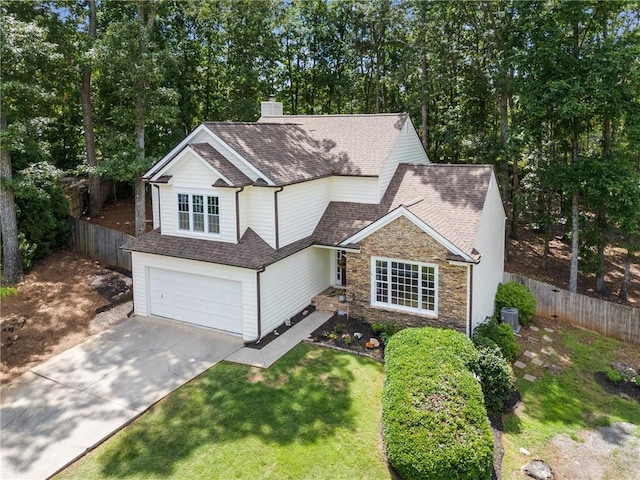 4816 Morning Chase NW, Acworth, GA 30102 - traditional-style house with stone siding, driveway, a shingled roof, an attached garage, and view of scattered trees