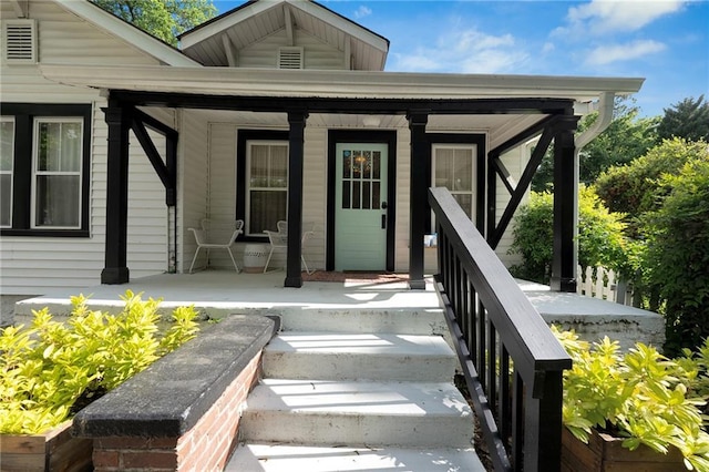 doorway to property featuring a porch