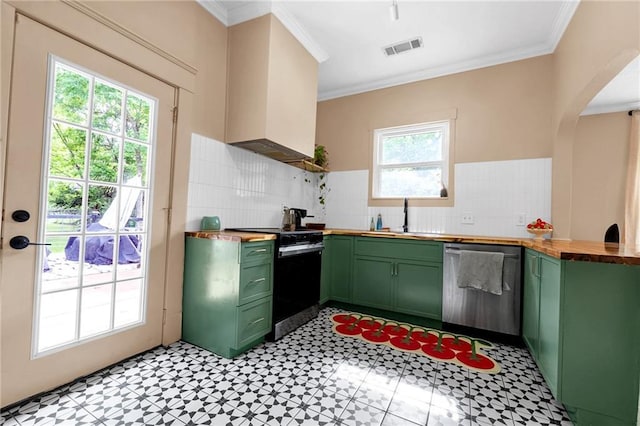 kitchen featuring green cabinets, dishwasher, black electric range oven, butcher block countertops, and ornamental molding