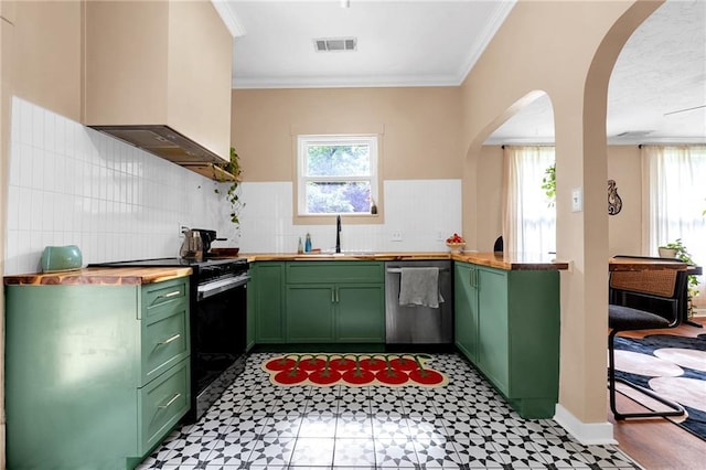 kitchen with green cabinetry, stainless steel dishwasher, gas stove, butcher block counters, and custom range hood