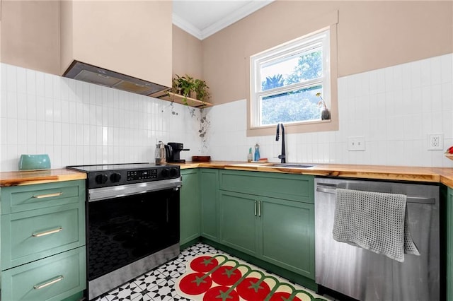 kitchen featuring butcher block countertops, dishwasher, stainless steel range with electric stovetop, green cabinetry, and a sink