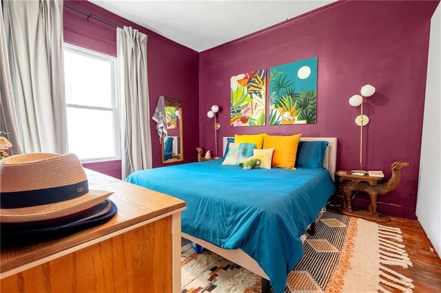 bedroom featuring wood finished floors