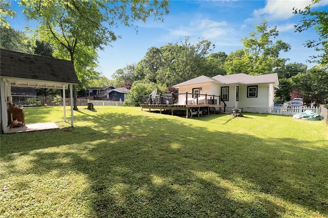view of yard featuring a wooden deck
