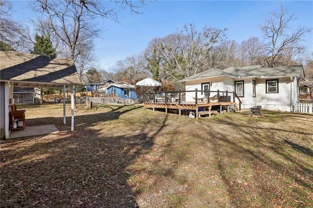 view of yard with a wooden deck