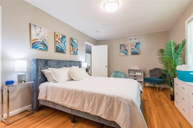 bedroom featuring visible vents and light wood-type flooring