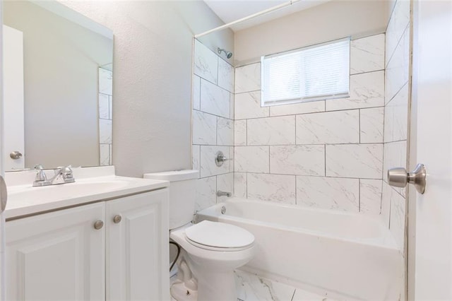 full bath featuring marble finish floor, toilet, vanity, and washtub / shower combination