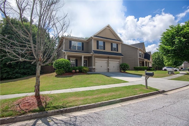 craftsman house with concrete driveway, a garage, and a front yard