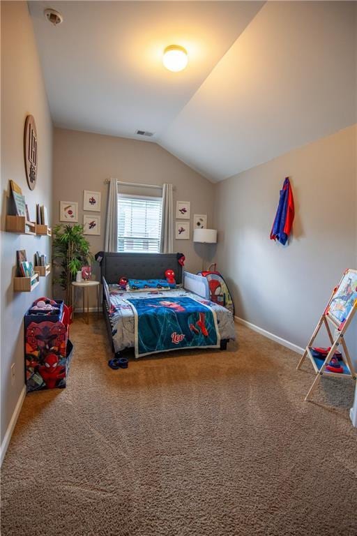 carpeted bedroom featuring vaulted ceiling and baseboards