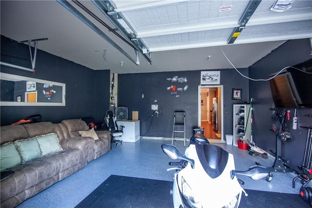 living room featuring a garage and speckled floor