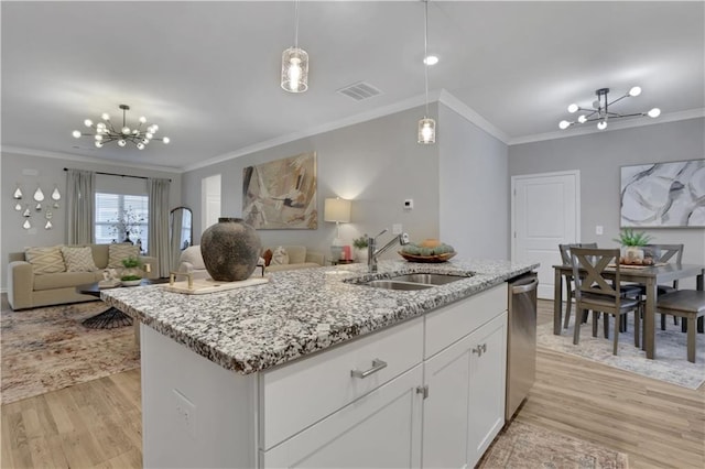 kitchen featuring a sink, visible vents, an inviting chandelier, and open floor plan