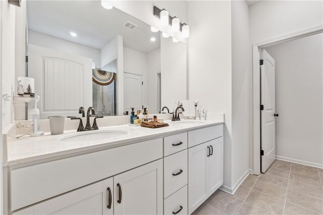 101 Marion Dr, Cartersville, GA 30120 - bathroom with double vanity, tile patterned flooring, tiled shower, and recessed lighting