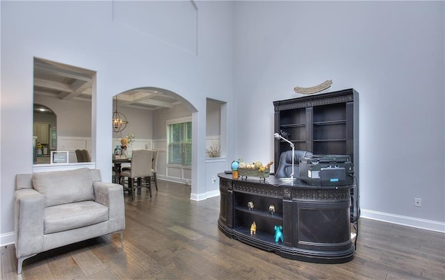 116 Chorley Run, Ellenwood, GA 30294 - office featuring coffered ceiling, arched walkways, wood finished floors, beamed ceiling, and a chandelier
