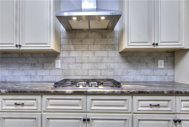 116 Chorley Run, Ellenwood, GA 30294 - kitchen with extractor fan, stainless steel gas stovetop, white cabinetry, and backsplash