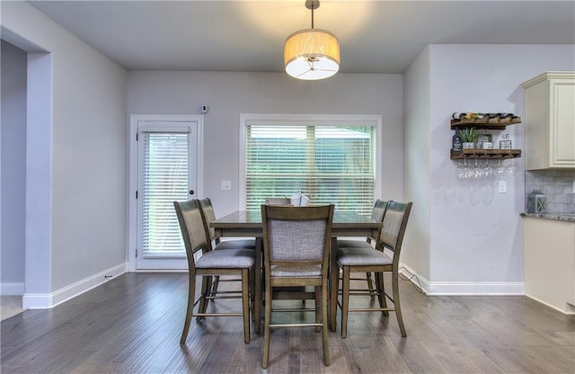 116 Chorley Run, Ellenwood, GA 30294 - dining room with dark wood-style flooring and baseboards