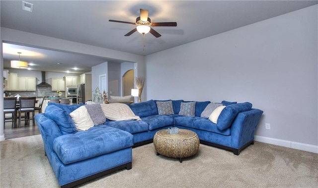 116 Chorley Run, Ellenwood, GA 30294 - living area featuring ceiling fan and light carpet