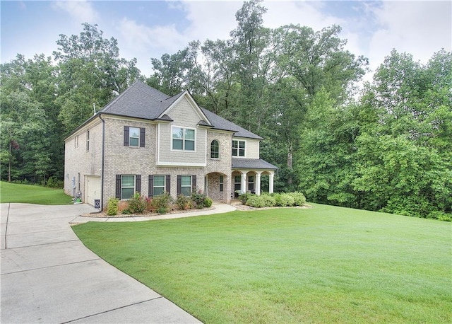 116 Chorley Run, Ellenwood, GA 30294 - view of front of home with concrete driveway, an attached garage, a front yard, and brick siding