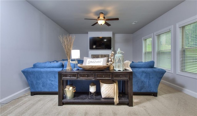 116 Chorley Run, Ellenwood, GA 30294 - carpeted living area with ceiling fan and a fireplace