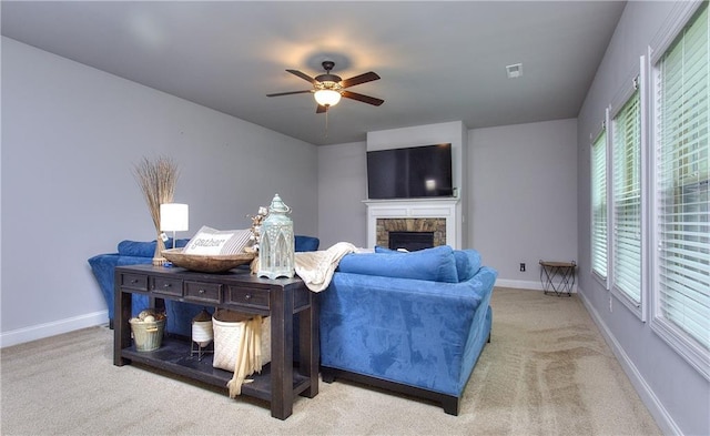 116 Chorley Run, Ellenwood, GA 30294 - carpeted living area with ceiling fan and a fireplace
