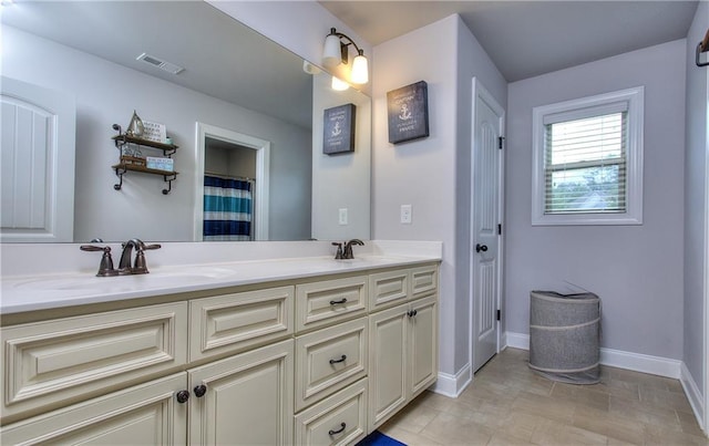 116 Chorley Run, Ellenwood, GA 30294 - bathroom with double vanity and baseboards
