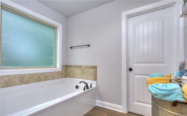 116 Chorley Run, Ellenwood, GA 30294 - full bathroom featuring a garden tub and wood finished floors