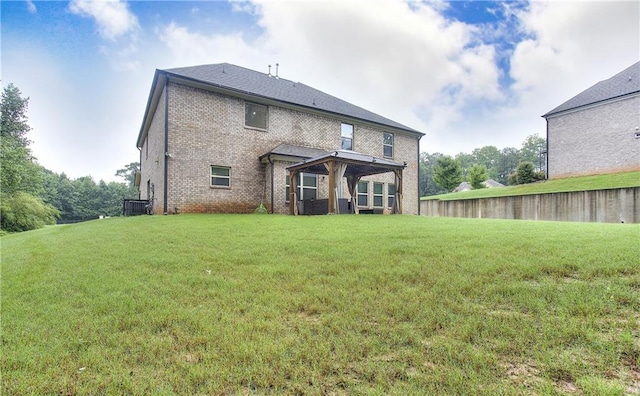 116 Chorley Run, Ellenwood, GA 30294 - back of property with brick siding and a yard