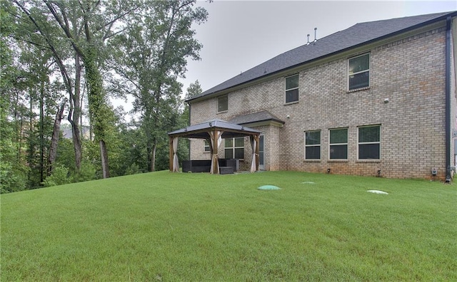 116 Chorley Run, Ellenwood, GA 30294 - back of property with a gazebo, a lawn, and brick siding