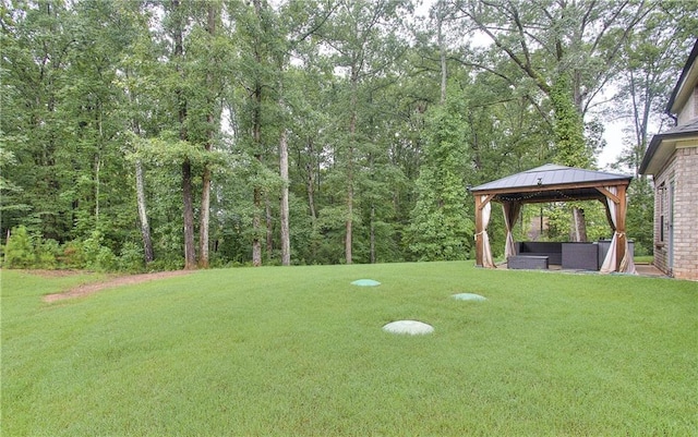 116 Chorley Run, Ellenwood, GA 30294 - view of green lawn featuring a gazebo and a wooded view